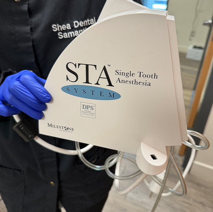 Dentist holding device that says single tooth anesthesia system