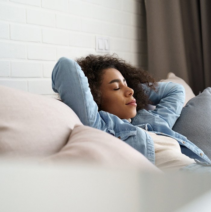 Patient resting on couch at home