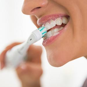 Woman brushing her teeth