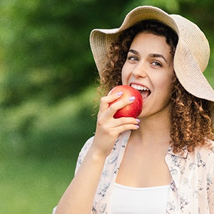 Woman eating an apple