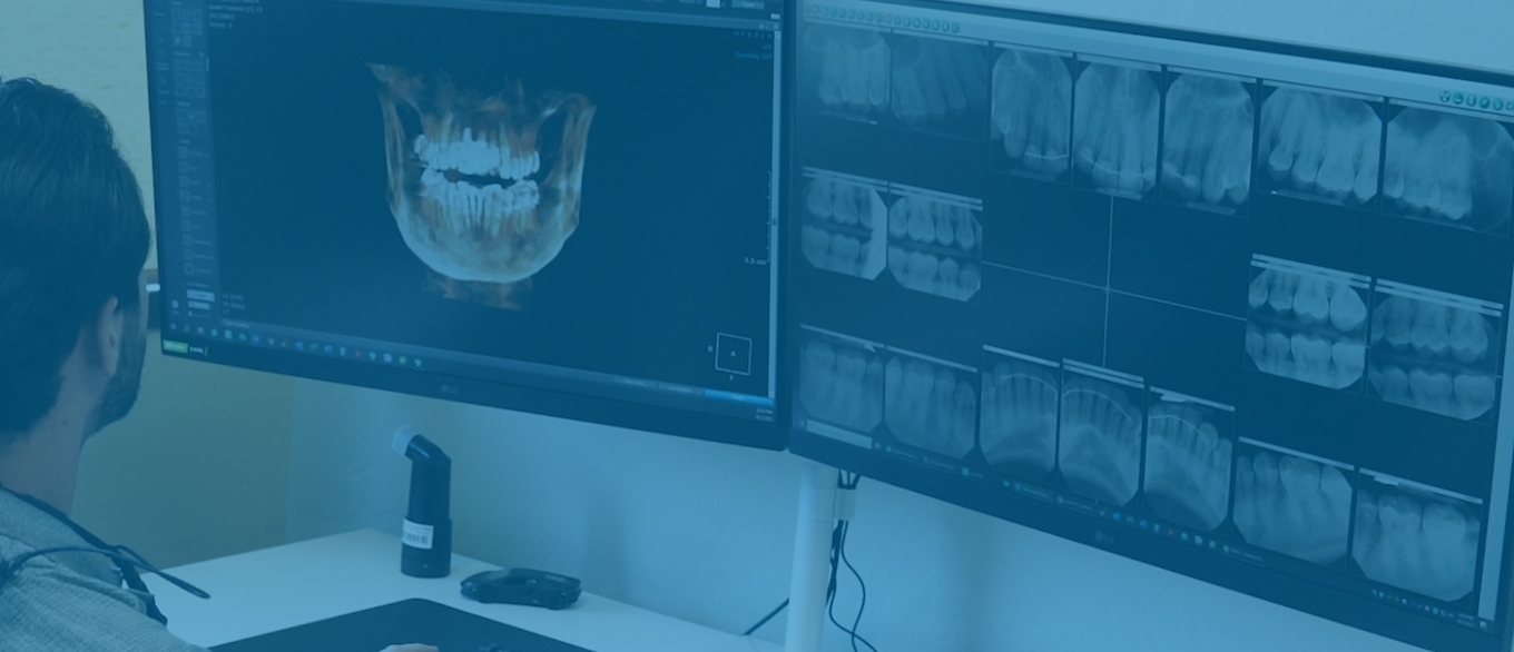 Scottsdale dentist looking at digital models of teeth on computer screen