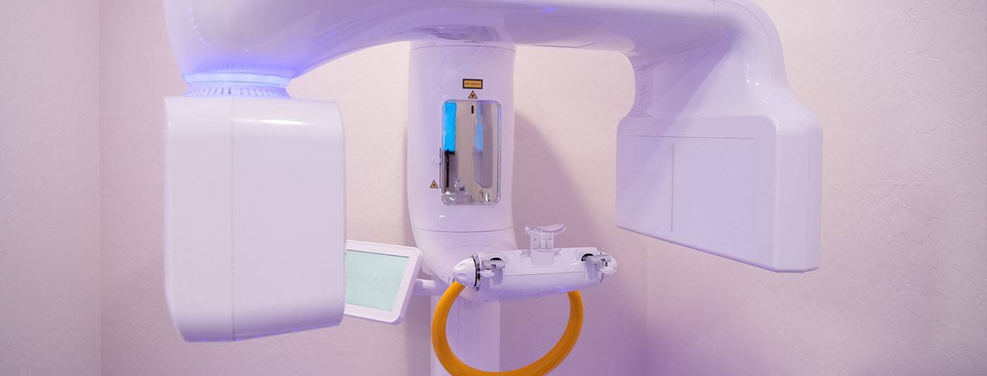 White dental scanning device against wall