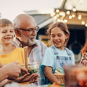 Invisalign patient eating with family