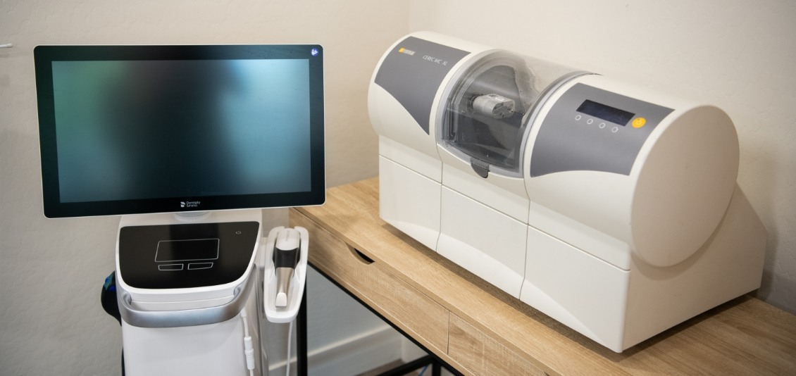 CEREC dental crown machine next to computer