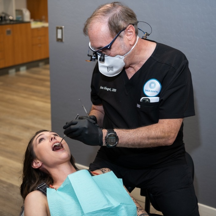 Doctor Siegel giving a patient a dental exam
