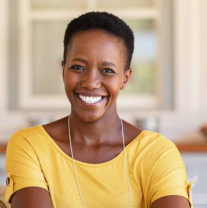 Woman in yellow shirt smiling